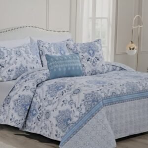 Juego de cama modelo Isla, que incluye fundas nórdicas reversibles estampadas con un diseño floral.