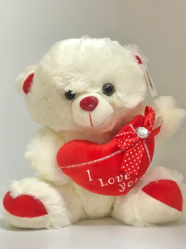Oso de peluche blanco con corazon y letrero "I Love You"