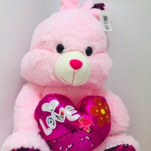 Conejo de peluche rosado con corazon y letrero "I Love You"