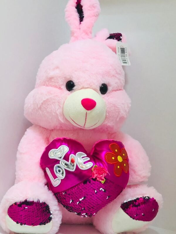 Conejo de peluche rosado con corazon y letrero "I Love You"
