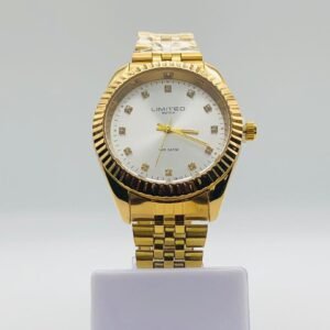 Reloj Limited de cuarzo en tono dorado con esfera plateada y marcadores de hora de cristal.