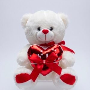 Oso de peluche blanco con corazón rojo