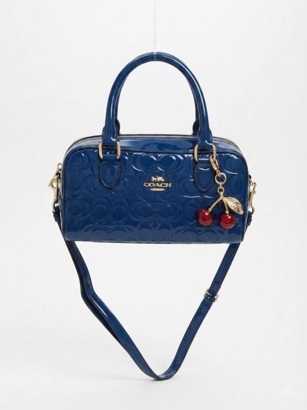 Bolso de mano Coach azul marino con patrón monograma