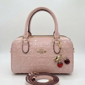 Bolso de mano Coach rosa con correa de hombro