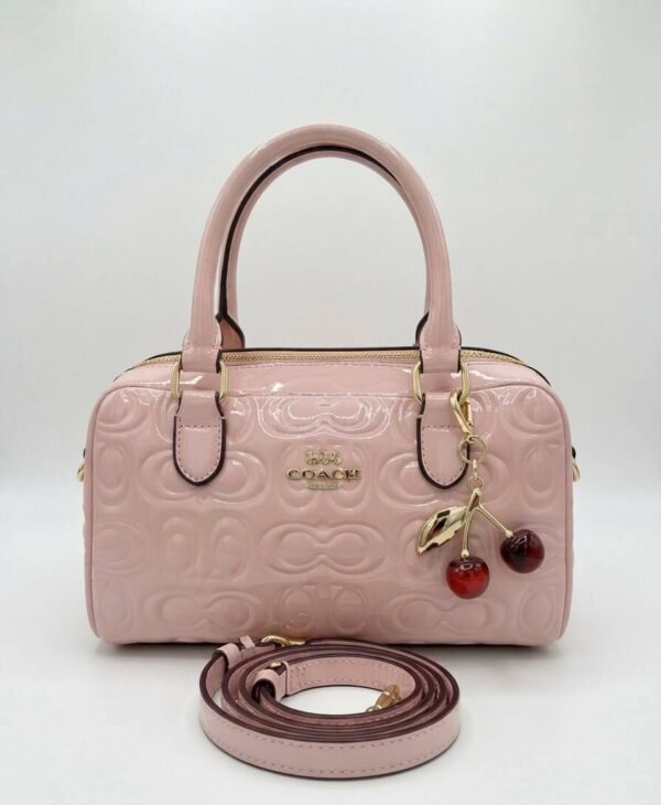 Bolso de mano Coach rosa con correa de hombro
